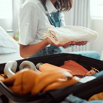 Woman packing light.