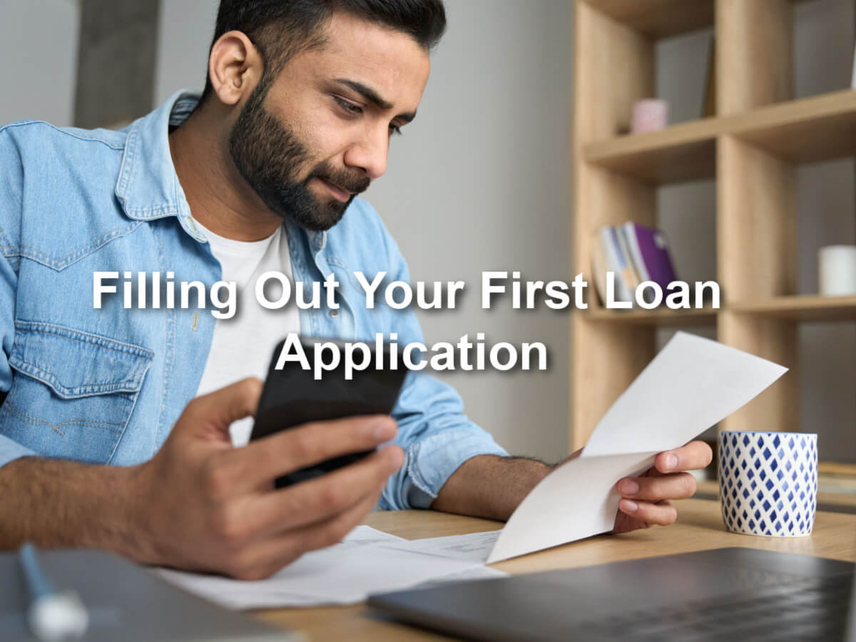 man filling out first loan application