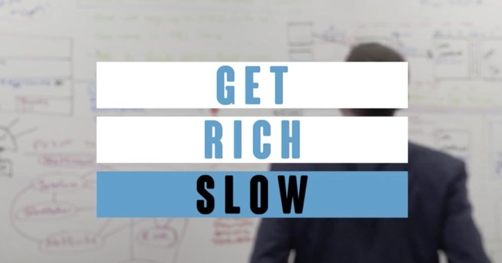 Get Rich Slow text over the man siluet