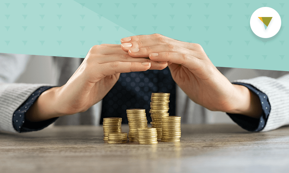 Hands covering coins