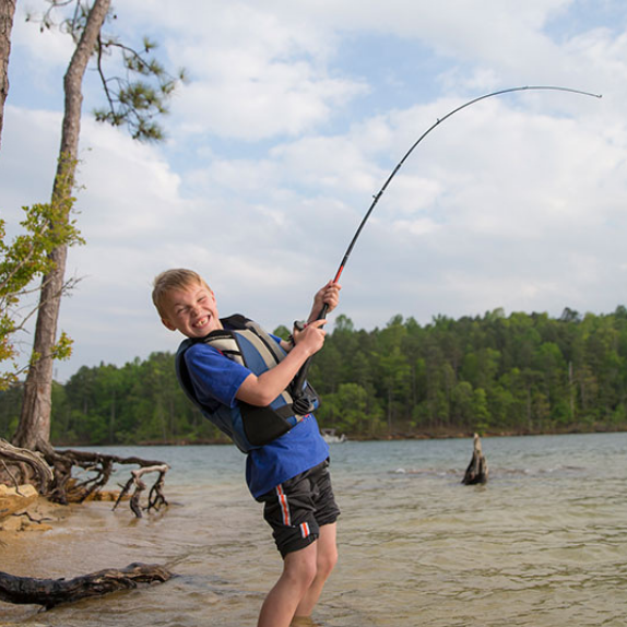Young boy with fishing poll.
