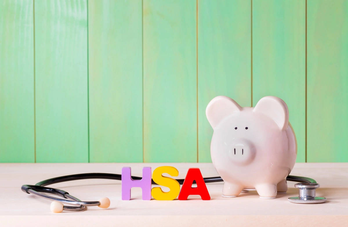 medicare and hsa words in front of piggy bank