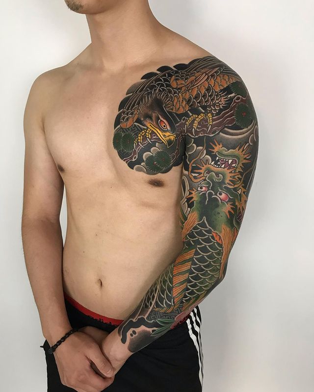 full arms tattoo of flowers in jap style