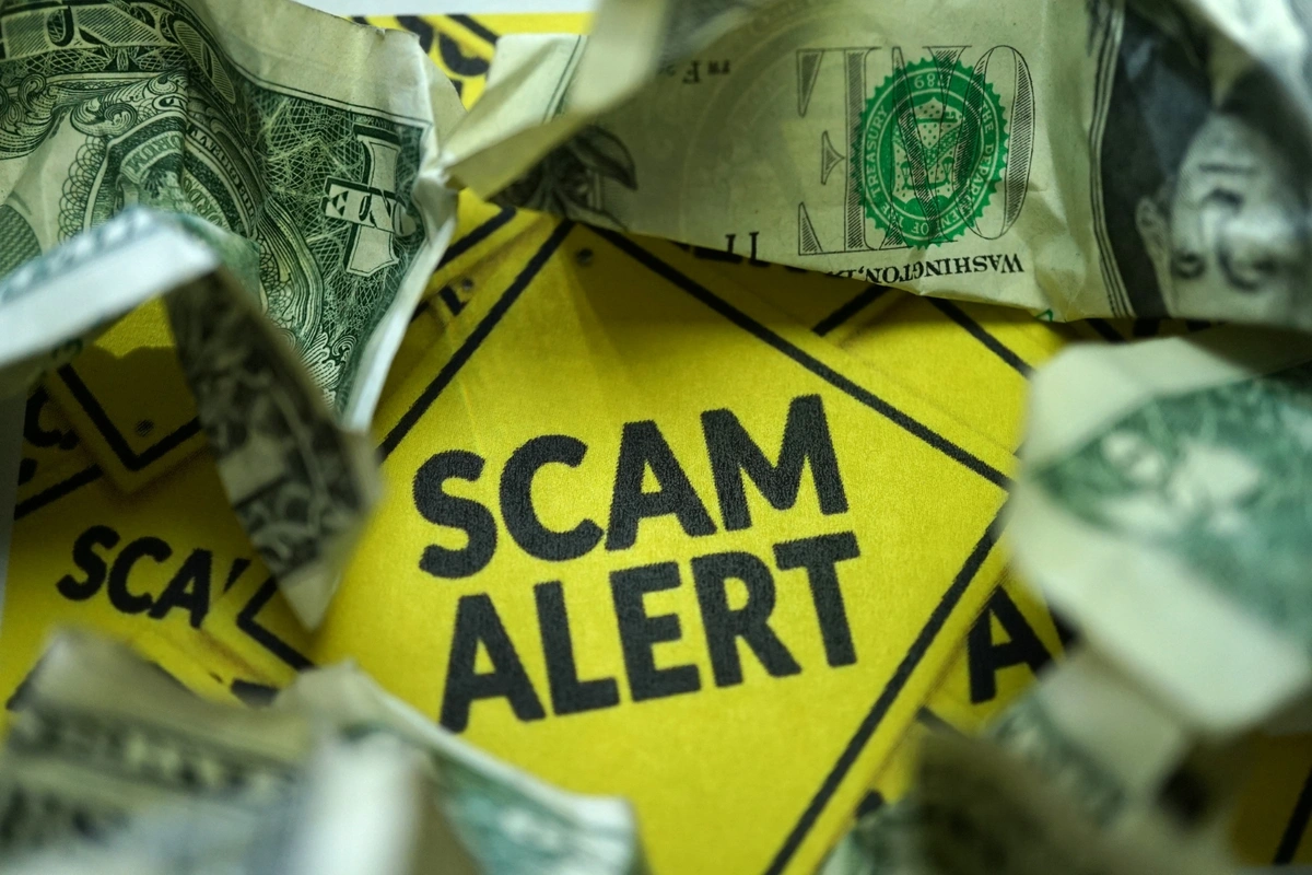 medicare scams and fraud alert surrounded by dollar bills