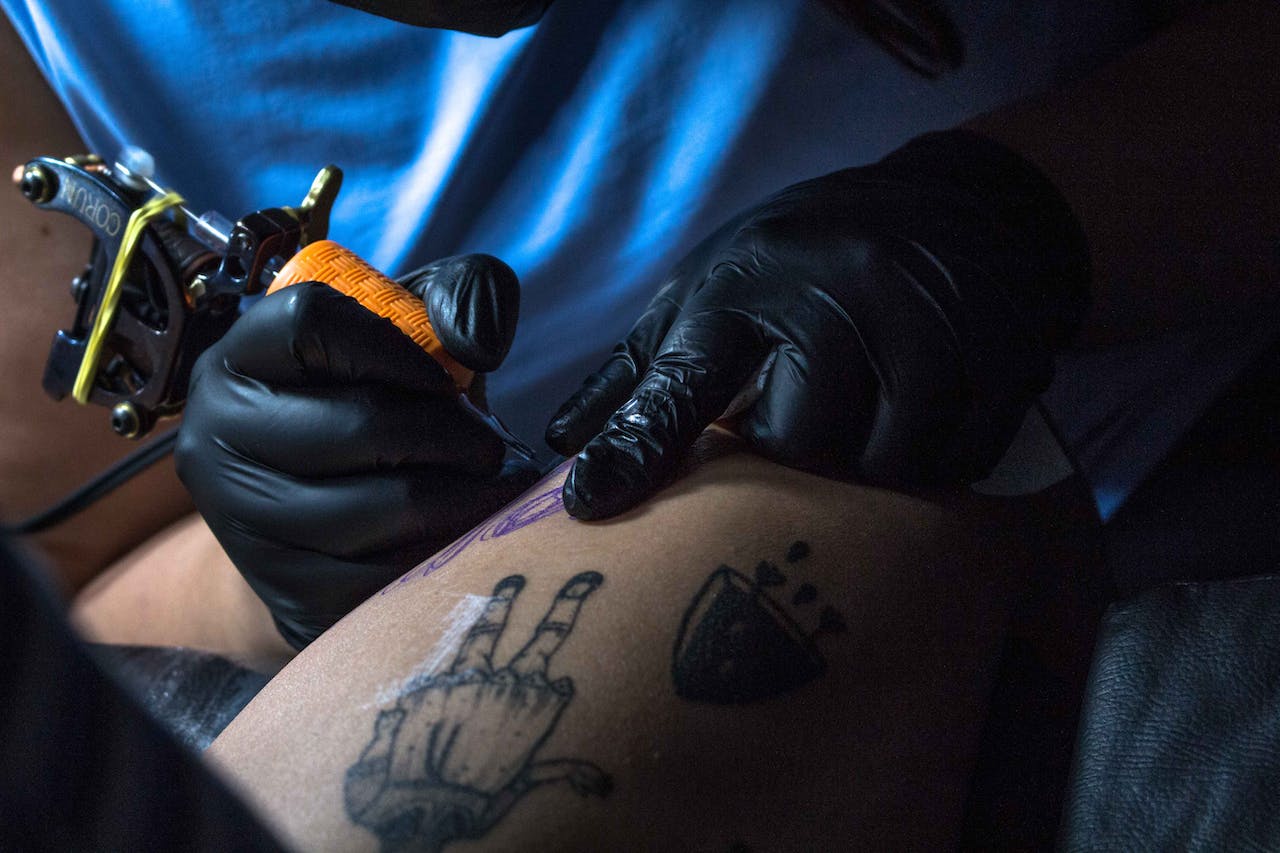 closeup of a thigh tattoo being made