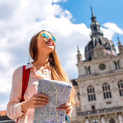 Woman looking at a map with confidence.