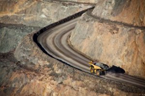 dumptruck driving down a mining road