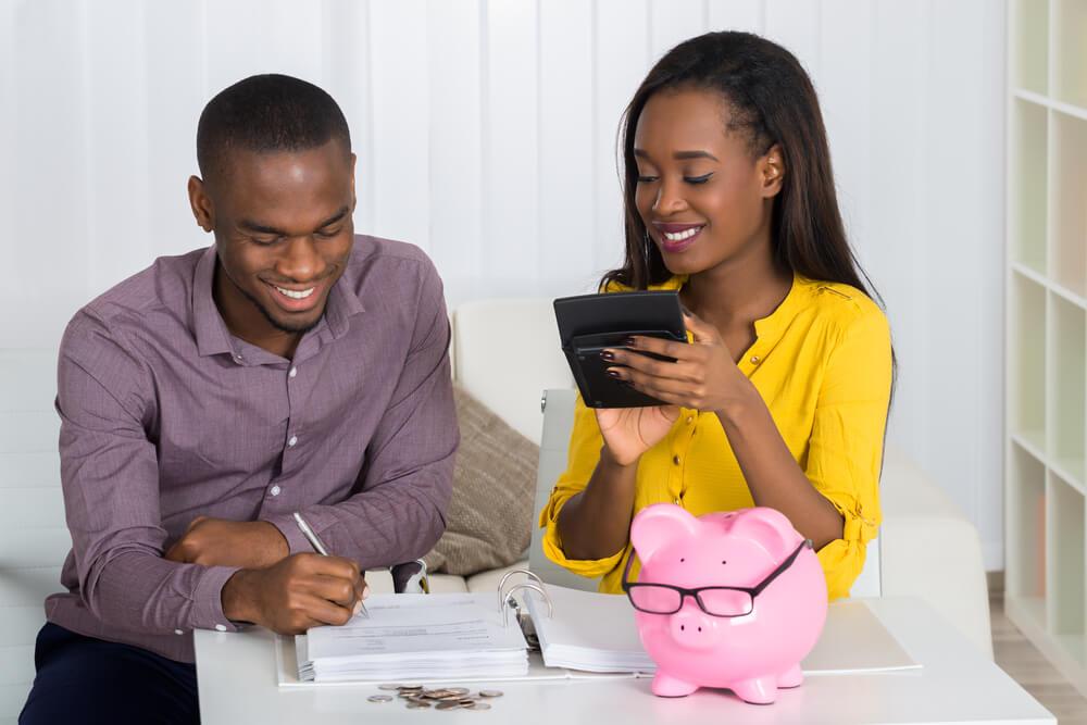 Couple budgeting and estimating their monthly expenses