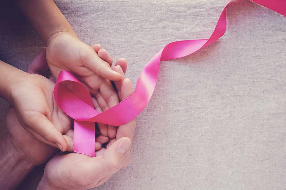 hands holding breast cancer ribbon