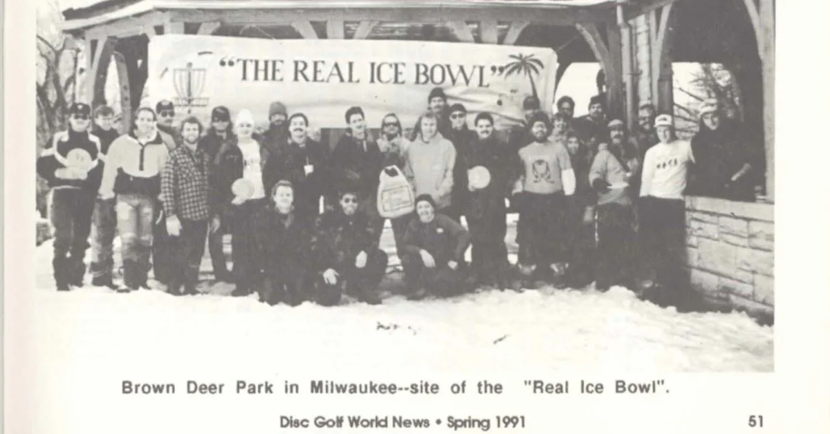 A black and white group photo of players at a disc golf tournament in front of a banner that says "the real ice bowl."