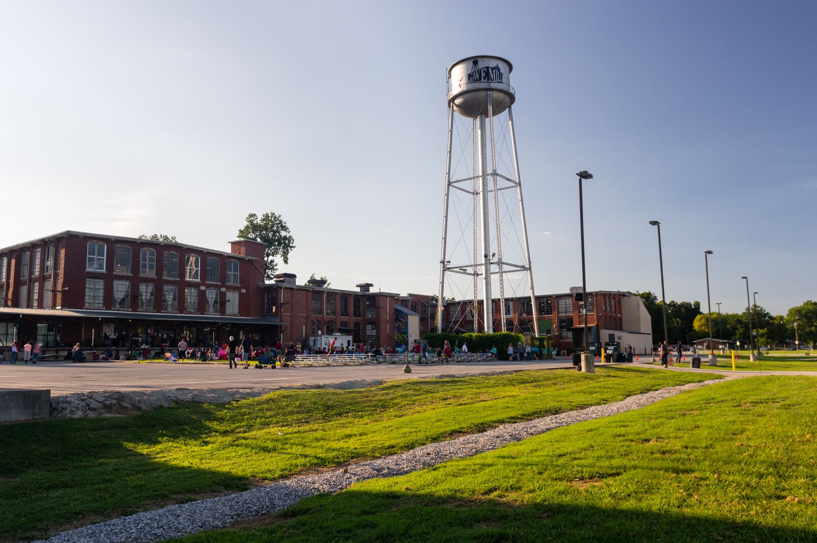 Water tower and school building with clear sky background