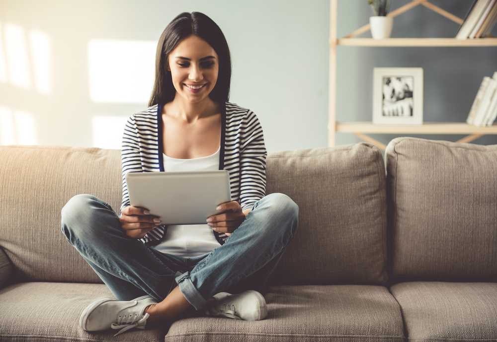woman looking at tablet
