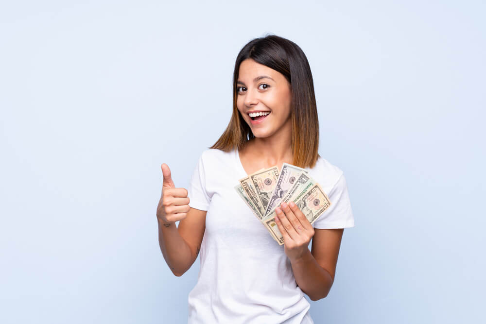 woman happy from payday loan money