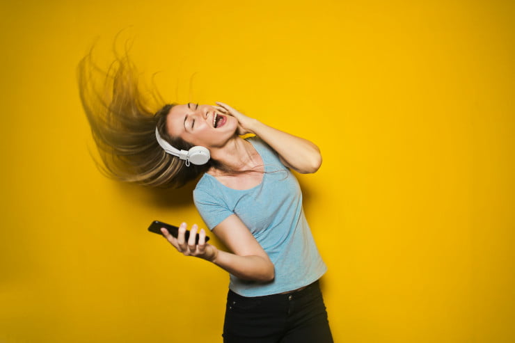 woman listening to music on Spotify
