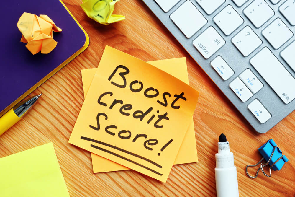 Post it note saying boost credit score