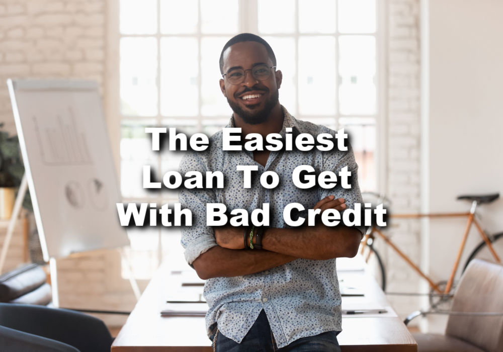 guy leaning on table thinking what's easiest loan for bad credit