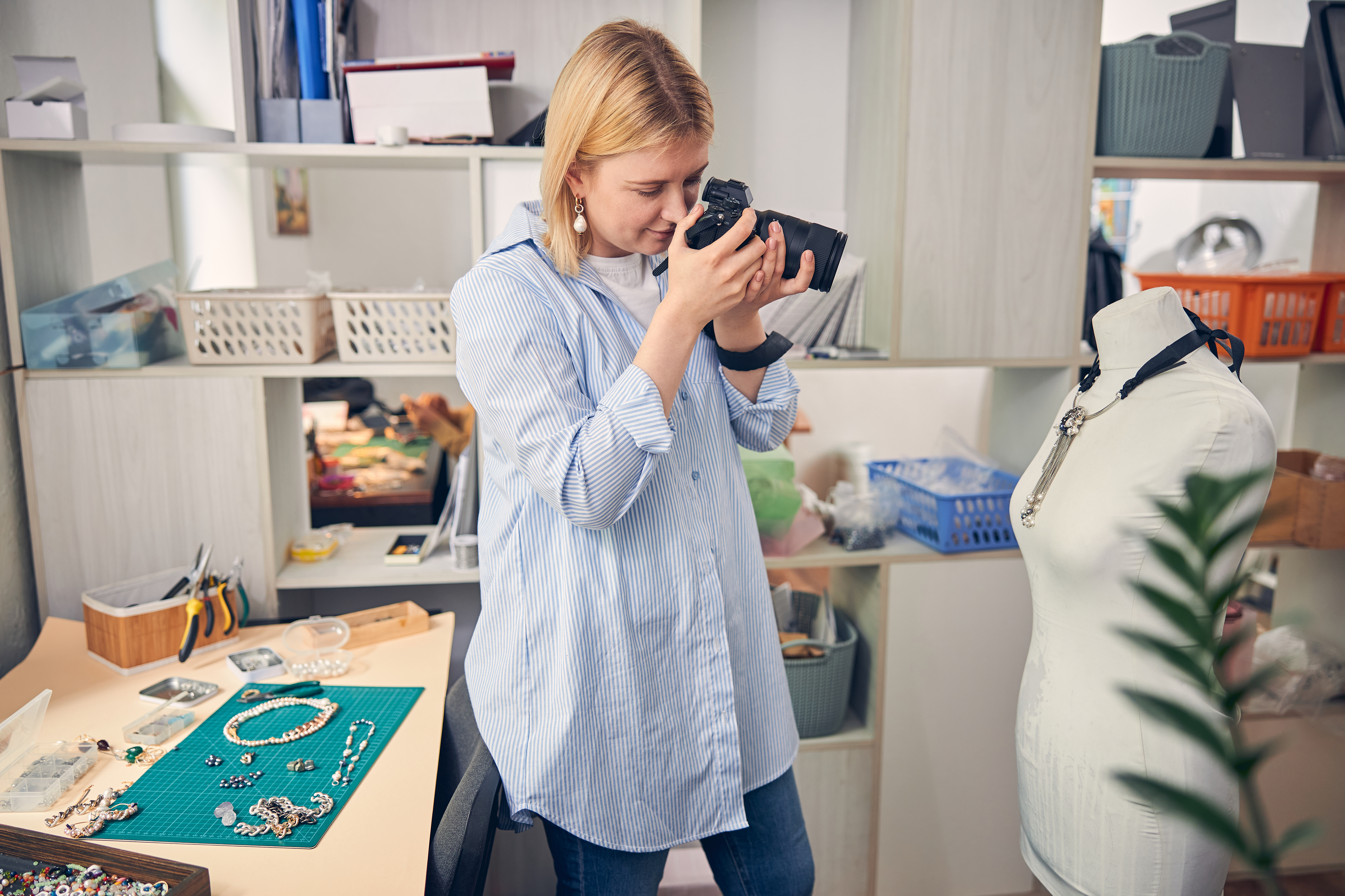 Woman photographing jewelry