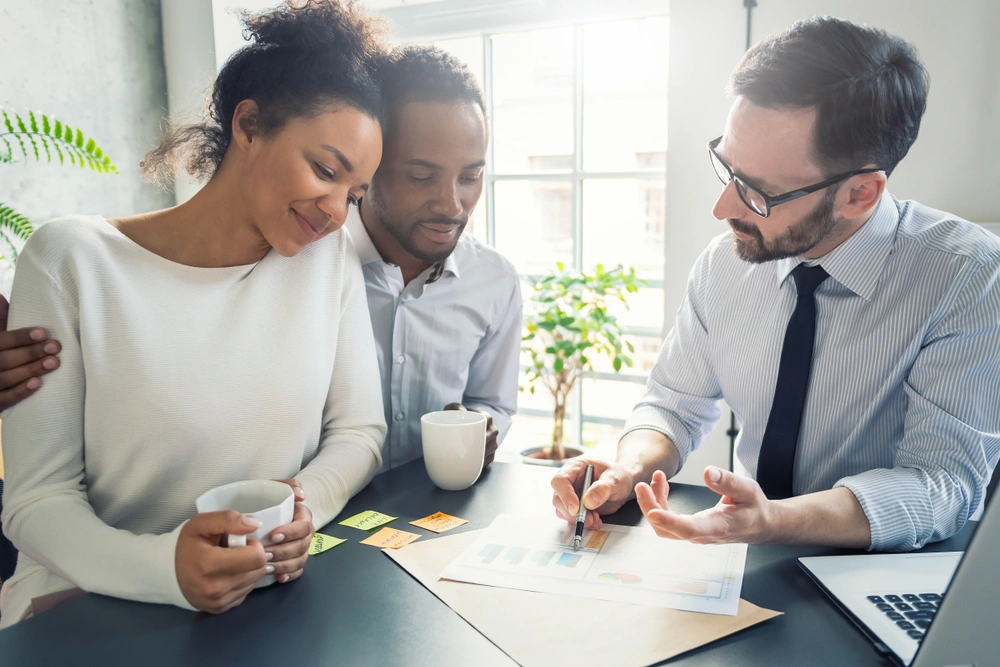 Couple at the bank speaking with an advisor