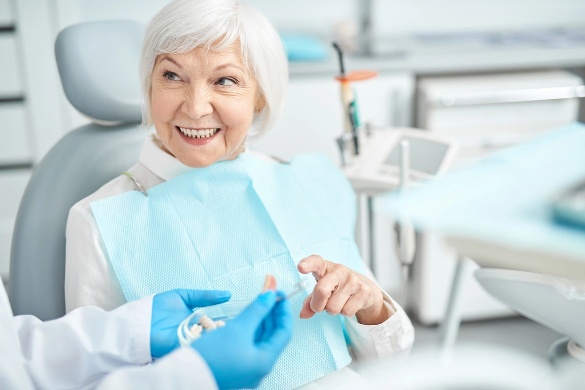woman in dental chair asking if medicare includes dental coverage