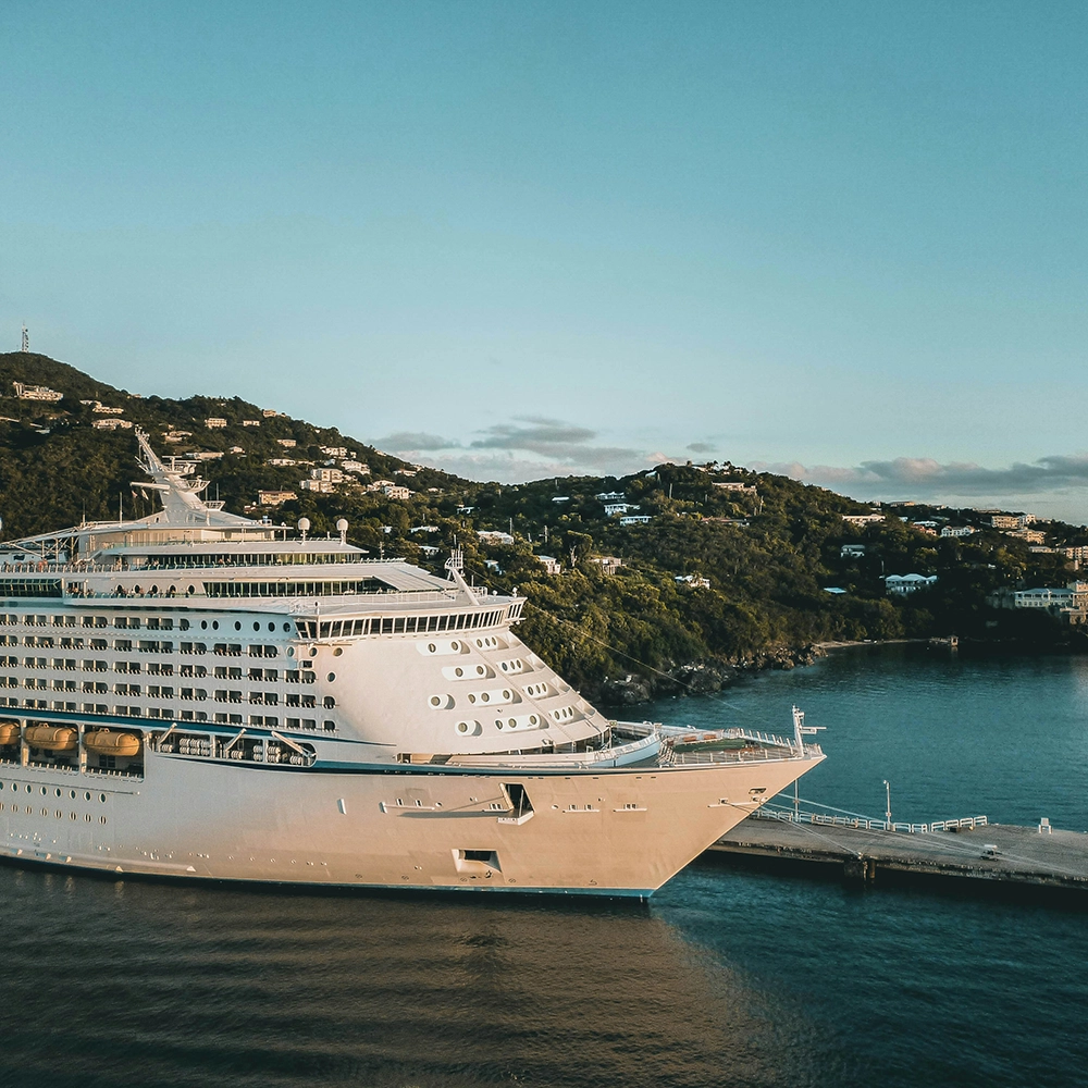 Docked cruise ship during sunset.