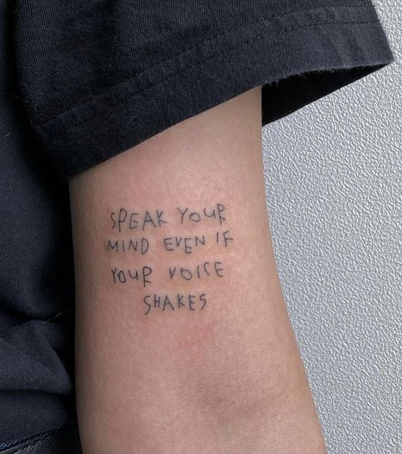quote tattoo on man's arm