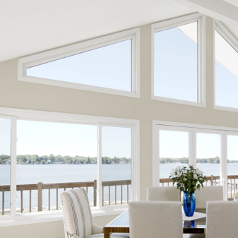 Interior dining room with white chairs and Infinity fiberglass polygon window