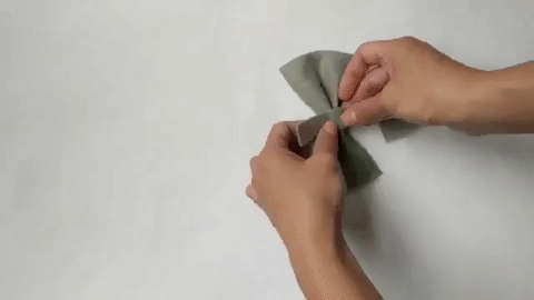 hot glue thin strip of felt around bow shape for DIY bow tie