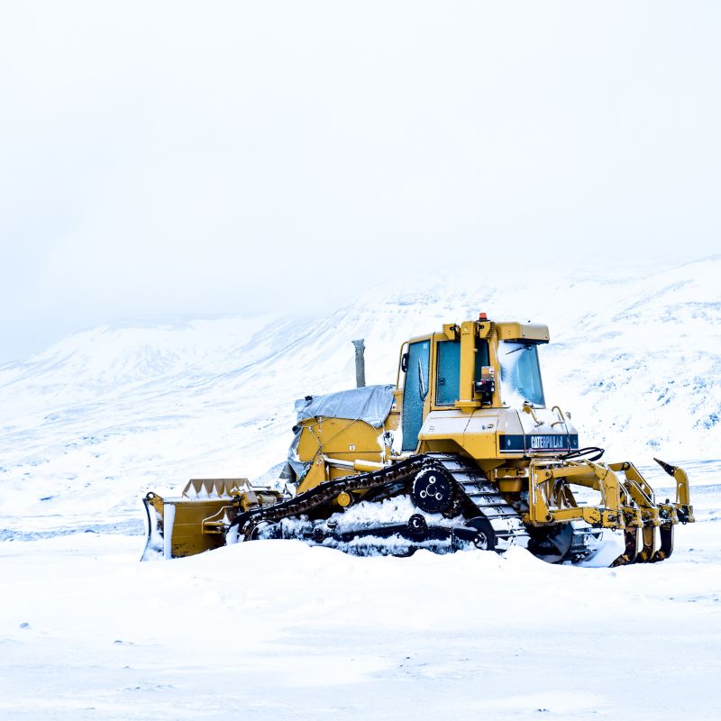 A bulldozer with tracks in the arctic