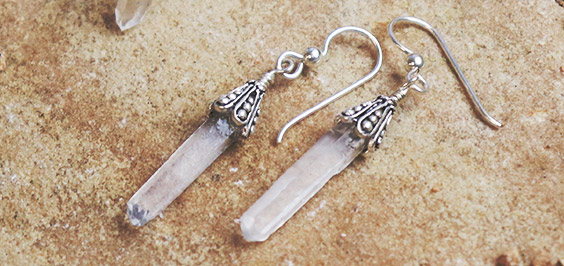 raw crystal dangling earrings with bead cap