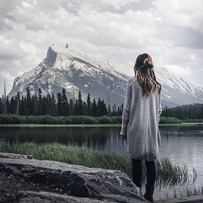 Young woman enjoying a snowy mountain view.