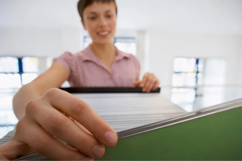 Finance professional organizing accounting documents