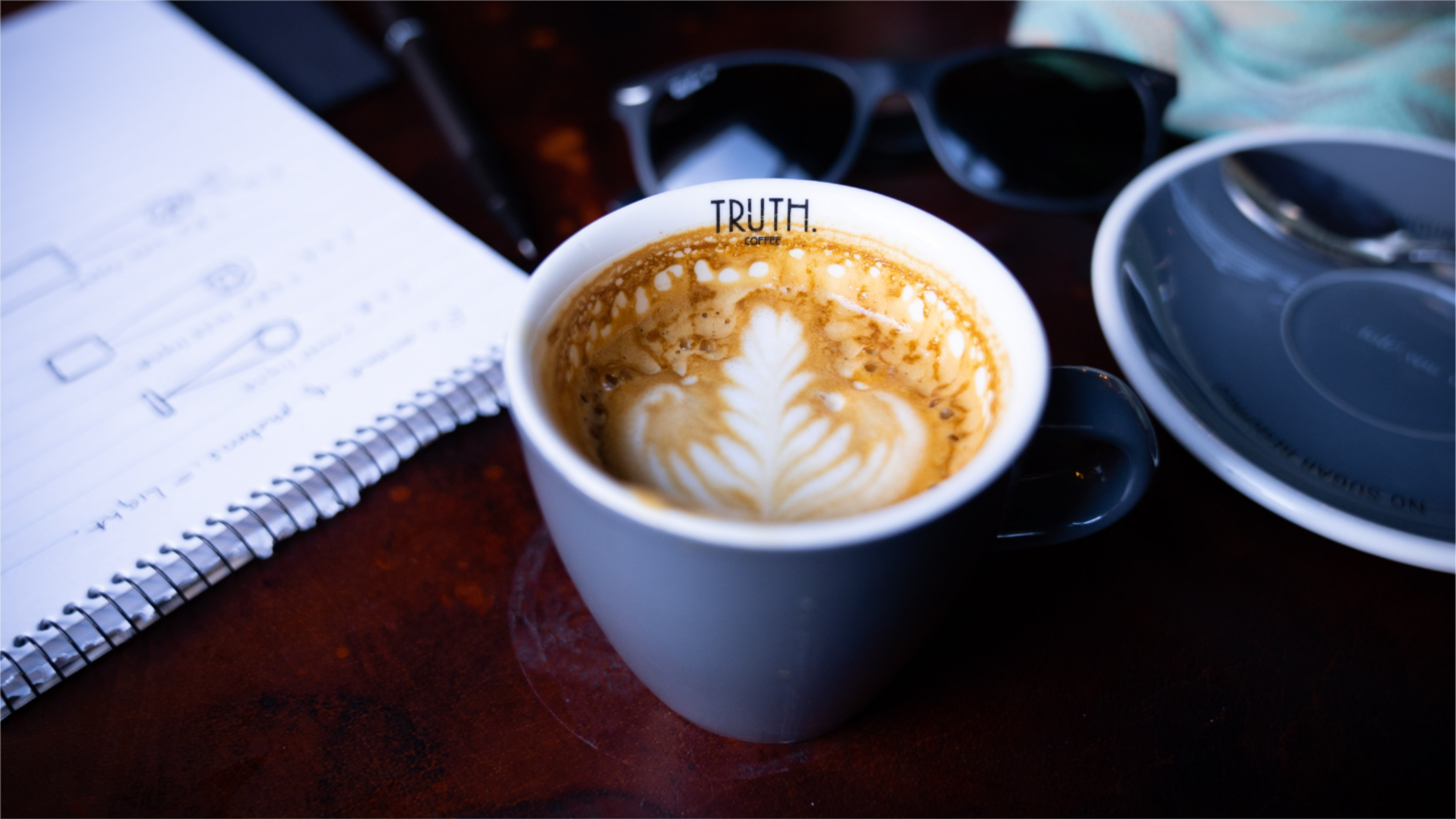 Fancy coffee with the word truth written on inside lip.
