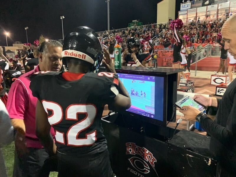 centennial-coach-and-player-sideline