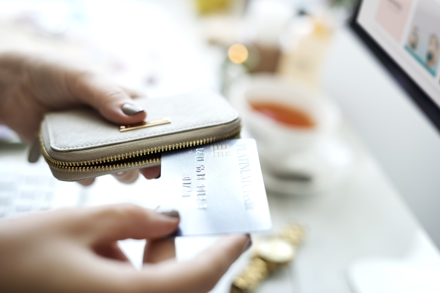 women taking out credit card from wallet