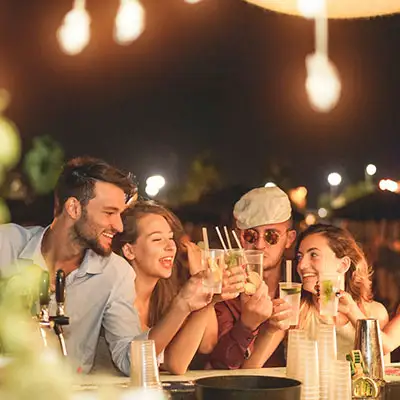 Vibrant young night life at beach bar.