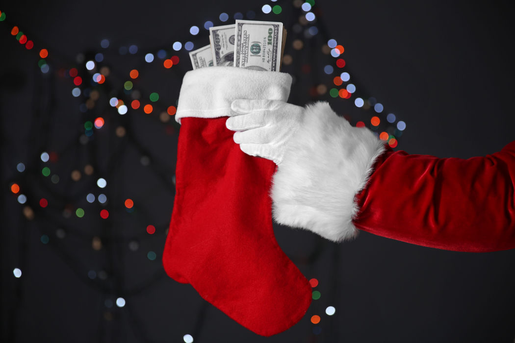 Santa gifts a stocking with cash from a holiday loan for Christmas.