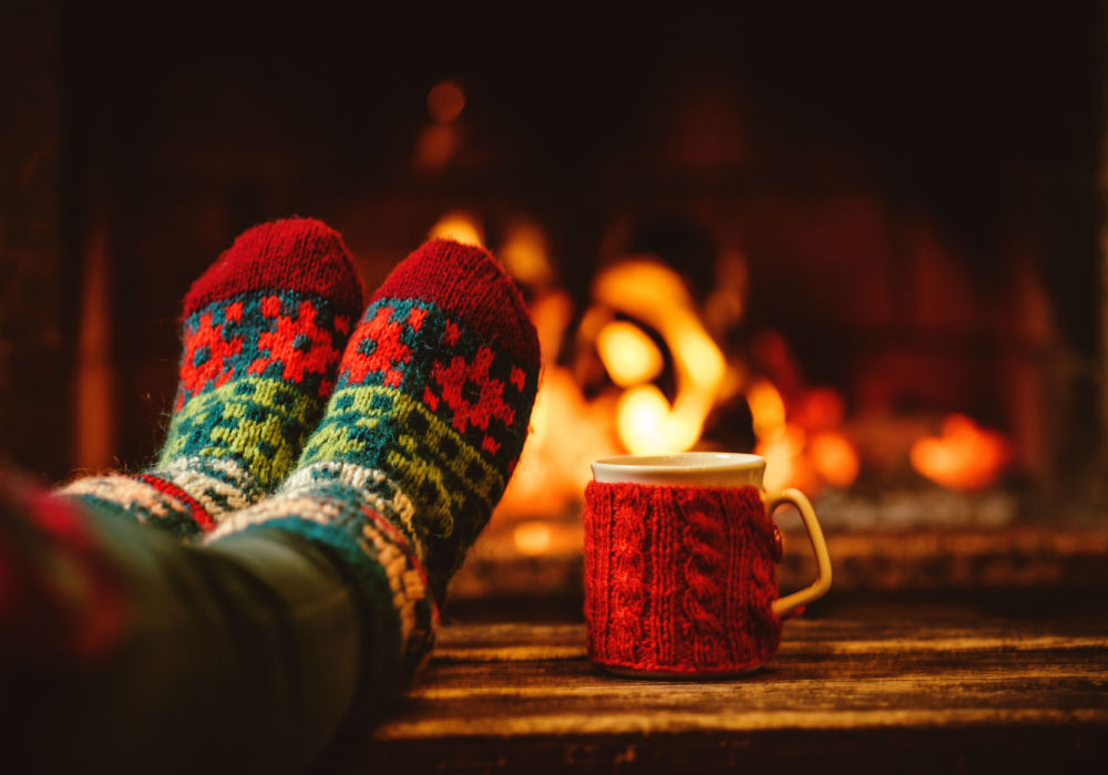 Warm socks, hot chocolate, and a fireplace signify a stress-free Christmas.