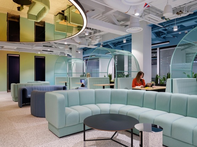 woman sitting at a hotdesk in a Huckletree office