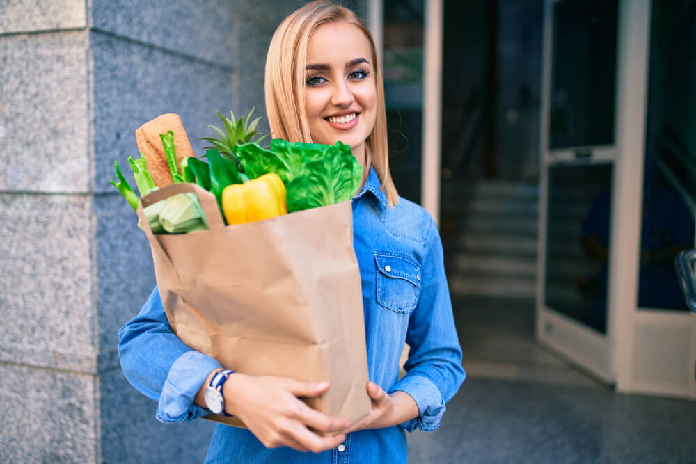 woman spending less on groceries