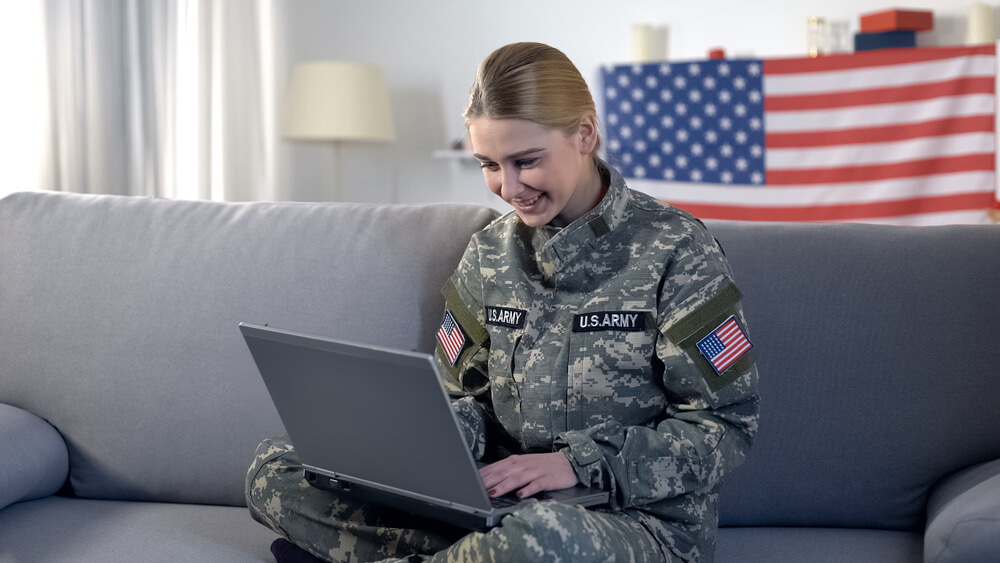 woman applying for a military veteran loan at home