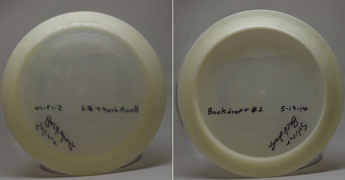 A semi-transparent disc seen from top and bottom with writing on clear tape in marker on it