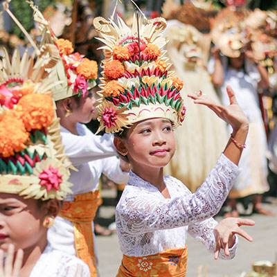 Young girl dancing in traditional attire.