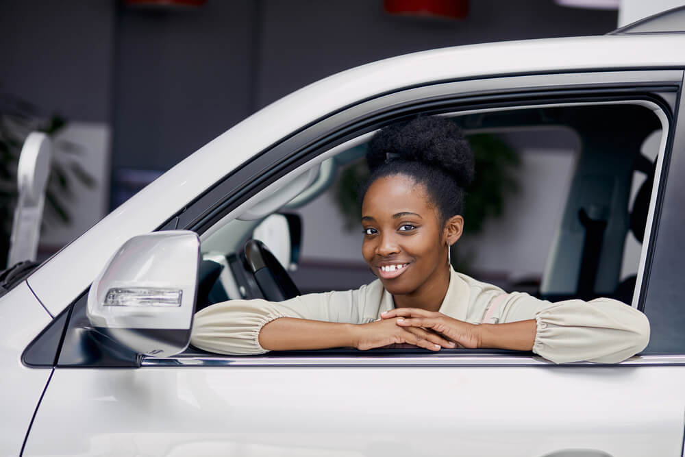 woman in car getting title loan