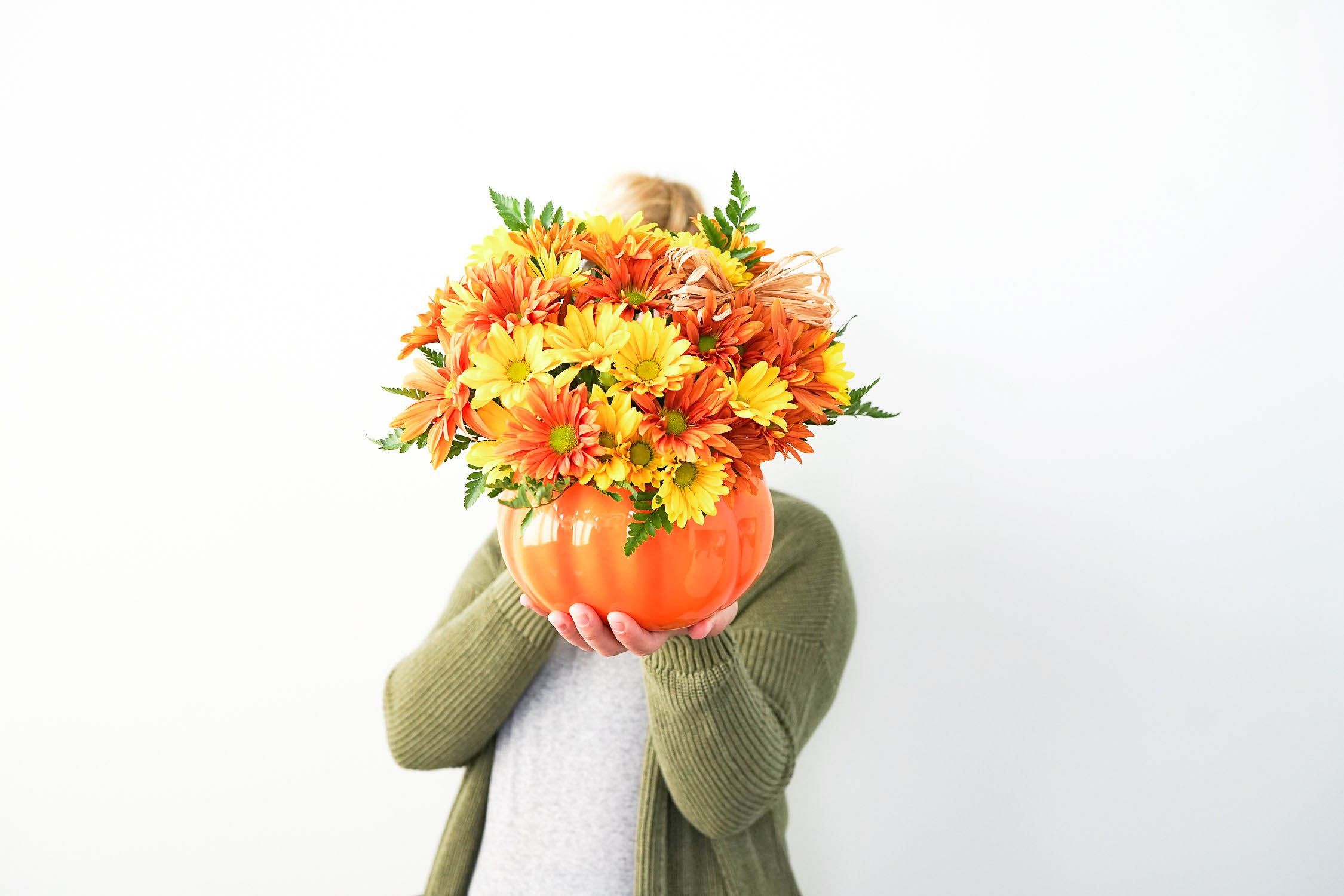 Pumpkin Vase with Orange and Yellow Flowers