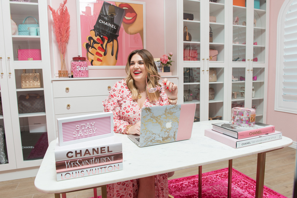 Sarah Tripp from sassy red lipstick at her desk