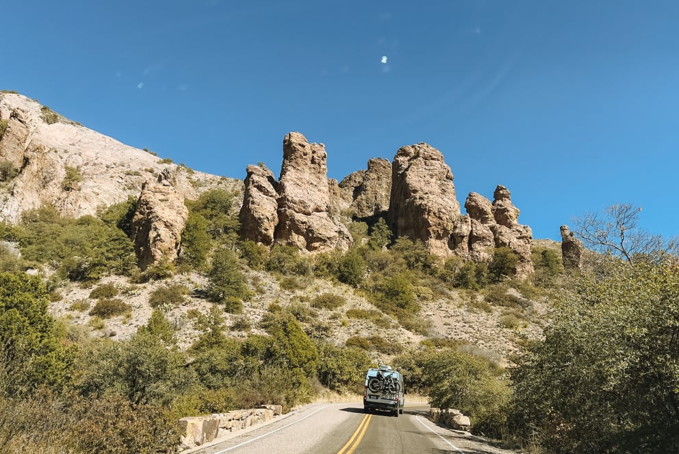 Class B RV driving on a road through big bend