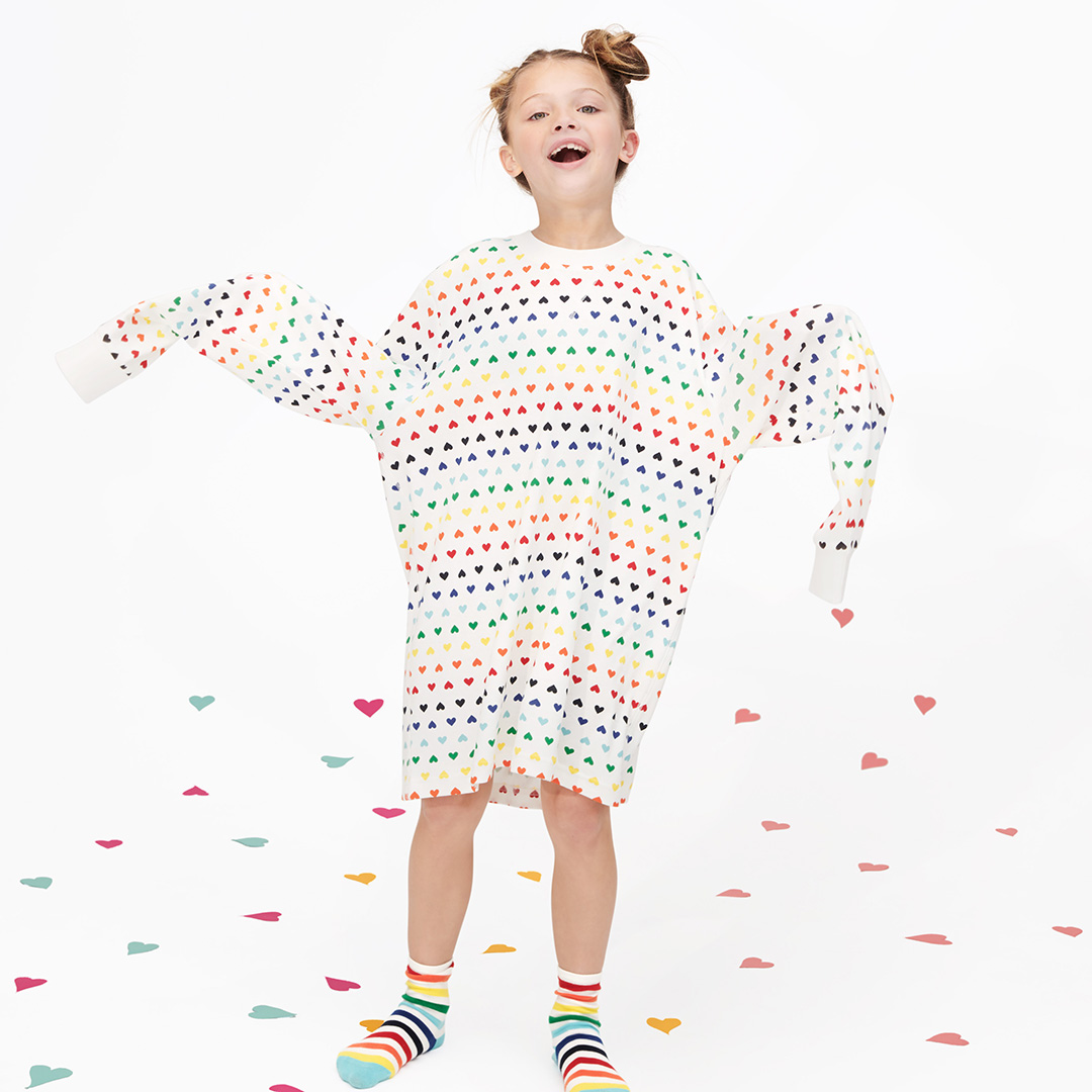 child wearing rainbow heart adult pajama top