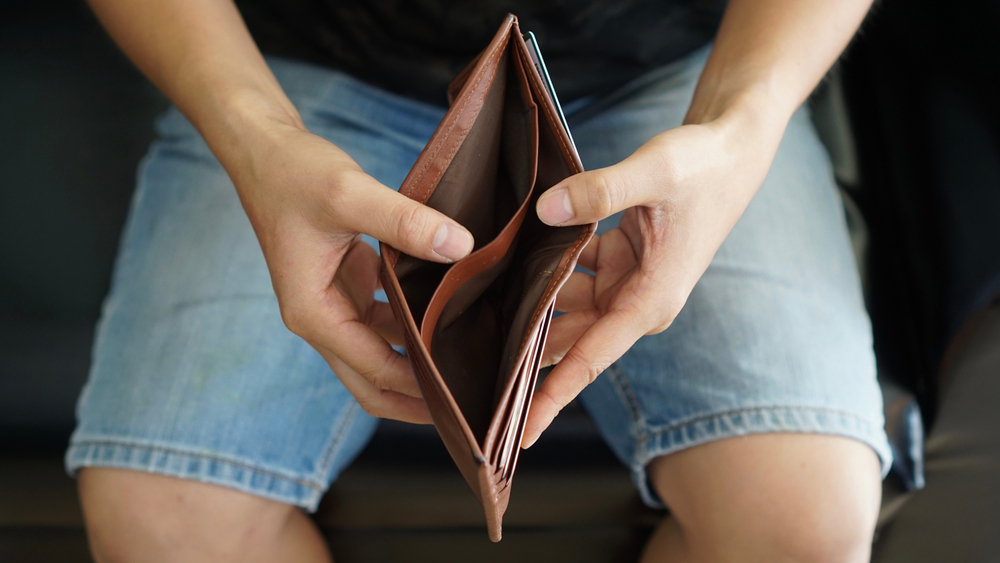 man with empty wallet