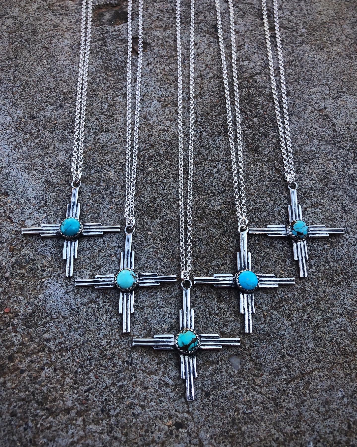 Group of sterling silver Zia necklaces with turquoise stones