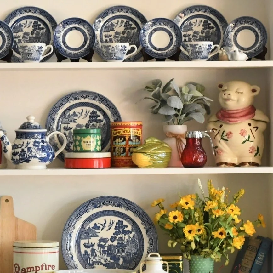 Vintage vibes featuring Blue Willow dinnerware and nostalgic collectibles.